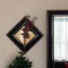 壁掛け仏壇「鏡壇ミラリエ」に今日（10/8）の誕生花の「ムラサキシキブ（紫式部）」を飾ってみました。
