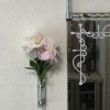 壁掛け仏壇「鏡壇ミラリエ」に今日（2/8）の誕生花の「シャクヤク（芍薬）」を飾ってみました。