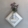 壁掛け仏壇「鏡壇ミラリエ」に今日（7/12）の誕生花の「ゼニアオイ」を飾ってみました。