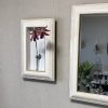 壁掛け仏壇「鏡壇ミラリエ」に今日（12/6）の誕生花の「カトレヤ（日之出蘭）」を飾ってみました。